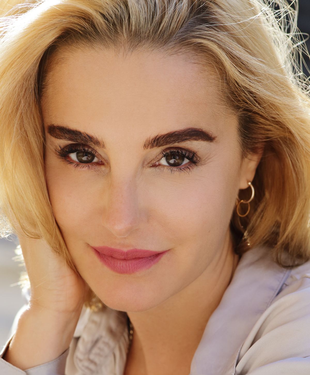 Close-up portrait of a woman with blonde hair.